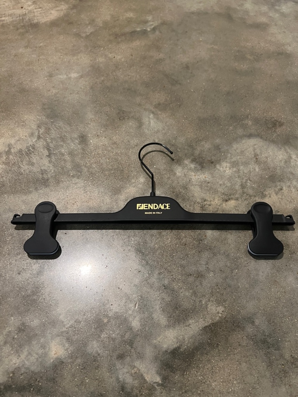 Authentic Fendace Branded Black Hanger with Gold Logo